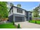 Beautiful two-story home featuring modern design, gray and white color scheme, and an attached garage at 921 Cone Rd, Forest Park, GA 30297