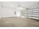Spacious two car garage with a large multi-paned window, offering ample parking and storage at 921 Cone Rd, Forest Park, GA 30297