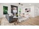 Cozy living room featuring modern decor, fireplace, and light wood floors at 921 Cone Rd, Forest Park, GA 30297