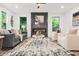 Bright living room with a fireplace, stylish furniture, and a decorative rug at 921 Cone Rd, Forest Park, GA 30297