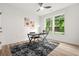 Home office featuring hardwood floors, a modern desk, and natural light from large windows at 921 Cone Rd, Forest Park, GA 30297