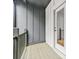 Outdoor patio features a wood floor and grey siding and access to the home's interior at 921 Cone Rd, Forest Park, GA 30297