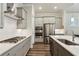 Modern kitchen featuring stainless steel appliances, a gray color palette, and a stylish range hood at 193 Idylwilde Way, Canton, GA 30115