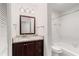 Full bathroom featuring granite countertops, a large mirror, and a shower-tub combo at 2116 N Forest Trl, Atlanta, GA 30338