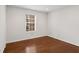 Bright bedroom with hardwood floors, large window, and plenty of natural light at 2116 N Forest Trl, Atlanta, GA 30338