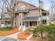 Exterior view of an attractive townhome with a welcoming front porch at 2116 N Forest Trl, Dunwoody, GA 30338