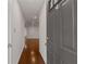 View of hallway features hardwood floors and recessed lighting upon entry at 2116 N Forest Trl, Dunwoody, GA 30338