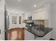 Modern kitchen featuring stainless steel appliances, stone countertops, and ample storage at 2116 N Forest Trl, Dunwoody, GA 30338