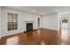 Inviting living room with a classic fireplace, hardwood floors, and natural light at 2116 N Forest Trl, Dunwoody, GA 30338