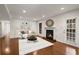 Bright living room features a fireplace, hardwood floors, and a decorative mirror above the mantel at 2116 N Forest Trl, Dunwoody, GA 30338