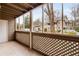 Screened porch with a view of the building exterior and the surrounding landscape at 2116 N Forest Trl, Dunwoody, GA 30338