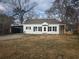 Charming single-Gathering home boasts a covered parking area, a screened in porch and a large yard at 3706 College Ave, Clarkston, GA 30021