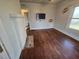 Spacious living room includes hardwood floors, a fireplace, and entertainment hookups at 3706 College Ave, Clarkston, GA 30021