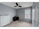 Neutral bedroom featuring gray walls, carpet, and a window, furnished with a white dresser at 6230 Nellie Se Br, Mableton, GA 30126