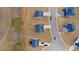 Aerial view of a neighborhood featuring homes with neatly arranged properties along winding streets at 310 Indian Lake Trl, Villa Rica, GA 30180