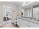 Well-lit bathroom featuring double sinks, granite countertops, and neutral tones at 310 Indian Lake Trl, Villa Rica, GA 30180