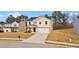 Attractive two-story home with a well-maintained lawn and a convenient two-car garage at 310 Indian Lake Trl, Villa Rica, GA 30180