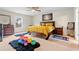 Bright main bedroom with a ceiling fan, queen bed, and decor at 310 Indian Lake Trl, Villa Rica, GA 30180