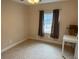 Cozy bedroom with plush carpeting, neutral walls, and a bright window at 4567 Duncan Dr, Sugar Hill, GA 30518