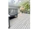 Spacious wooden deck with outdoor dining set and backyard views, perfect for entertaining at 4567 Duncan Dr, Sugar Hill, GA 30518
