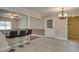 Spacious dining area with tile flooring and a stylish bar for entertaining at 4567 Duncan Dr, Sugar Hill, GA 30518
