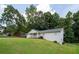 Quaint single-Gathering home with a charming front porch and a lush green lawn at 4567 Duncan Dr, Sugar Hill, GA 30518