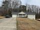 Charming single Gathering home with a well-maintained front yard and attached one car garage at 4567 Duncan Dr, Sugar Hill, GA 30518