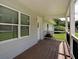 Inviting front porch with wood flooring and white railings, perfect for relaxing at 4567 Duncan Dr, Sugar Hill, GA 30518
