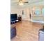 Open-concept living room with views into kitchen and dining area at 4567 Duncan Dr, Sugar Hill, GA 30518