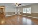 Bright living room with wood floors, neutral paint, and a large window at 4567 Duncan Dr, Sugar Hill, GA 30518