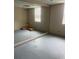 Room with large wall mirror, and unfinished flooring at 4567 Duncan Dr, Sugar Hill, GA 30518