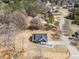 Aerial view of a residential neighborhood with a newly built home, manicured lawn and asphalt-paved streets at 1270 Sandhill Hulett Rd, Villa Rica, GA 30180