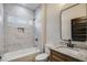 Stylish bathroom with tub, marble tile surround, and modern fixtures at 1270 Sandhill Hulett Rd, Villa Rica, GA 30180