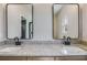 Bathroom with double sinks, granite countertop, and modern fixtures at 1270 Sandhill Hulett Rd, Villa Rica, GA 30180