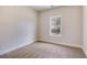 Neutral bedroom featuring plush carpet, natural light, and fresh white trim at 1270 Sandhill Hulett Rd, Villa Rica, GA 30180