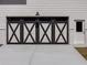 Close-up of modern garage doors with decorative cross pattern at 1270 Sandhill Hulett Rd, Villa Rica, GA 30180
