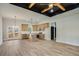 Open concept kitchen with light wood cabinets, stainless steel appliances, island, and double doors to the outside at 1270 Sandhill Hulett Rd, Villa Rica, GA 30180