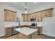 Kitchen featuring stainless steel appliances, light wood cabinets, an island, white countertops, and a subway tile backsplash at 1270 Sandhill Hulett Rd, Villa Rica, GA 30180