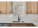 Beautiful kitchen featuring stainless steel appliances, light wood cabinets, and a farmhouse sink at 1270 Sandhill Hulett Rd, Villa Rica, GA 30180