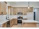 Beautiful kitchen with stainless steel appliances, light wood cabinets, island, and white countertops and backsplash at 1270 Sandhill Hulett Rd, Villa Rica, GA 30180