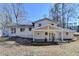 Rear exterior of the home with a covered patio, showcasing the outdoor living space at 1591 Autumn Hurst Trl, Stone Mountain, GA 30088