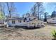 Backyard view of the house, highlighting the spacious yard and outdoor features at 1591 Autumn Hurst Trl, Stone Mountain, GA 30088