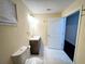 Bathroom with vanity, toilet, mirror and a view to a secondary room at 24 Moreland Ne Ave, Atlanta, GA 30307