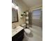 Updated bathroom with decorative plant shelves and tiled shower with a bathtub at 24 Moreland Ne Ave, Atlanta, GA 30307