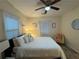 Comfortable bedroom featuring a ceiling fan, a queen-size bed, and soft decor, making it a cozy retreat at 24 Moreland Ne Ave, Atlanta, GA 30307