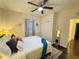 Well-lit bedroom with ceiling fan, closet and a glimpse of a mirror and hallway at 24 Moreland Ne Ave, Atlanta, GA 30307