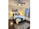 Bedroom featuring hardwood floors, a ceiling fan, a bed, and an area rug at 24 Moreland Ne Ave, Atlanta, GA 30307