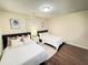 Bedroom with two beds and hardwood floors at 24 Moreland Ne Ave, Atlanta, GA 30307