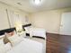 Bedroom with two beds, hardwood floors, and a nightstand at 24 Moreland Ne Ave, Atlanta, GA 30307