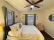 Inviting bedroom featuring a ceiling fan, cozy decor, and natural light from two windows for a calming retreat at 24 Moreland Ne Ave, Atlanta, GA 30307